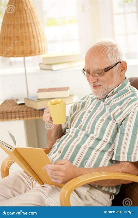 Elderly Man Reading Book And Having Tea Stock Photo Image Of Adult