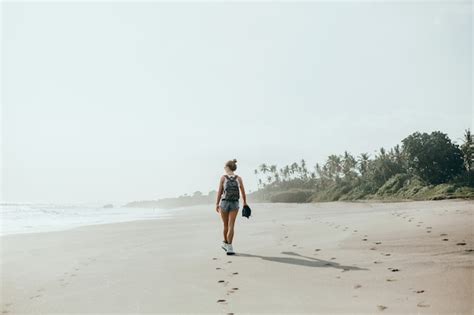 Free Photo Young Beautiful Girl Posing On The Beach Ocean Waves