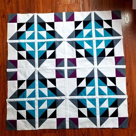 A Piece Of Cloth That Has Been Made Into A Quilt With Different Colors