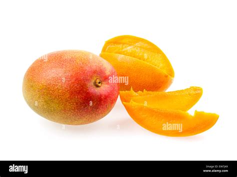 Whole And Cut Mangos With Mango Fruit Slices Isolated On White