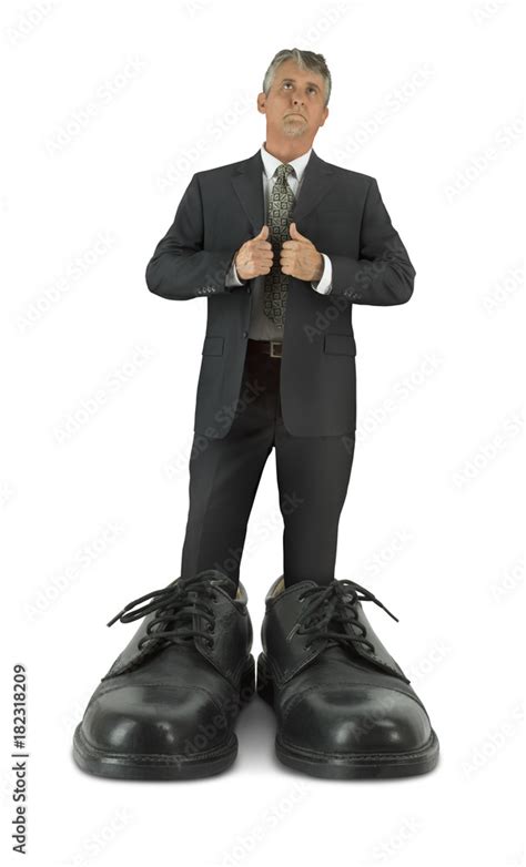 Some Big Shoes To Fill Showing Man In Suit Standing In Giant Shiny