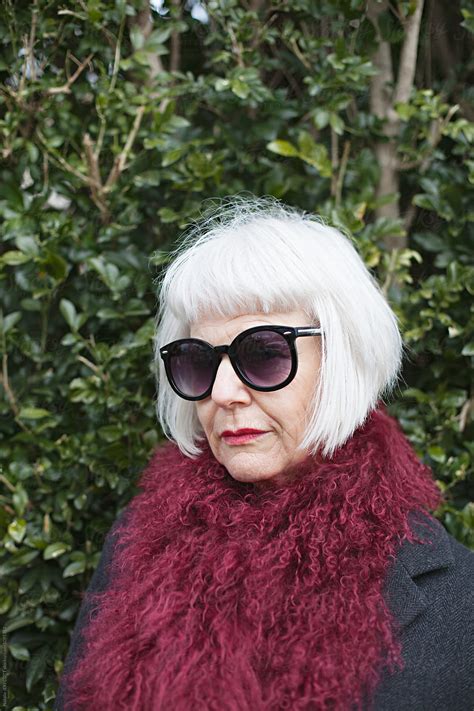 "Stylish And Attractive Older Woman Outdoors Wearing A Scarf And ...