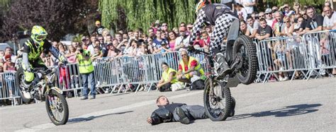 Moto Show In Central Square Of City Tricks On Atv Stuntmen Stunt Man