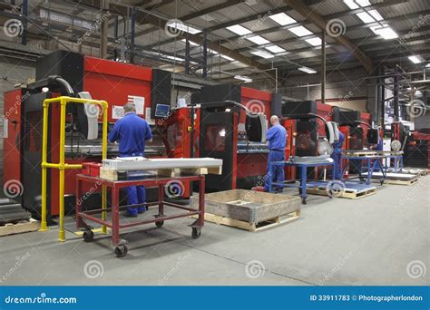 Workers At Manufacture Workshop Operating Machines Stock Image Image