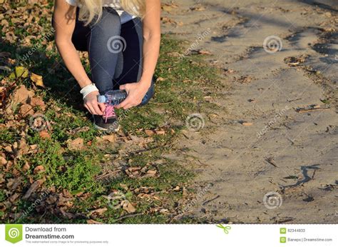 Jogging Woman Tying Laces On Her Sneaker Stock Image Image Of Ready