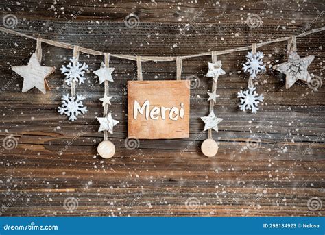 Wooden Decorated Christmas Label With French Text Merci Stock Image