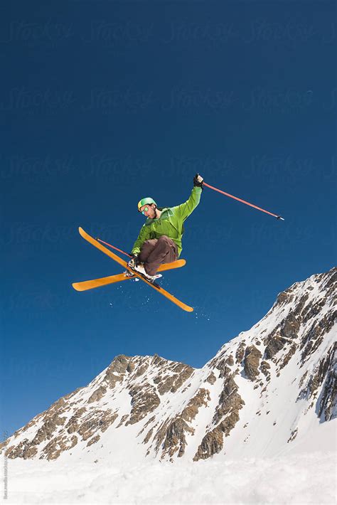 "Male Rider Performing Helicopter Ski Trick Midair Against The Blue Sky ...