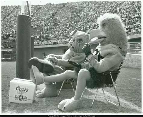 Southern Miss mascot "Seymour" and Mississippi State mascot "Bully" relax behind the goalpost ...