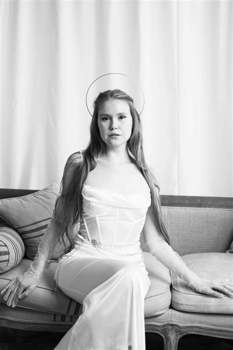 Pretty Bride Sitting on a Sofa · Free Stock Photo