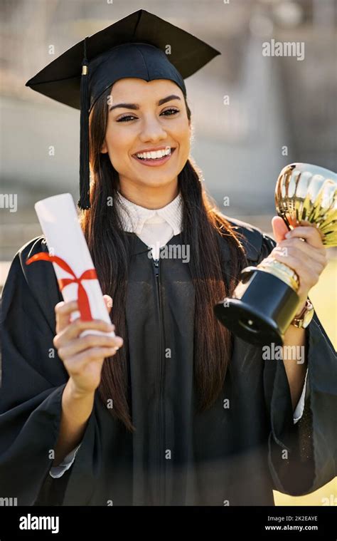 Shes Achieved Outstanding Merit Portrait Of A Student Holding Her