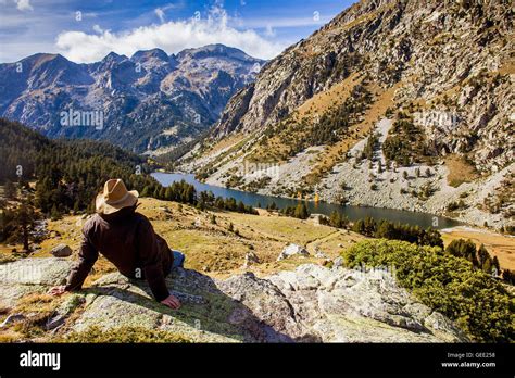 Man Sitting Estany Llong Llong Lake From The Vicinity Of Portarro De