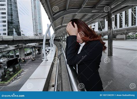 Exhausted Young Asian Businesswoman With Hand On Face Feeling Tired And