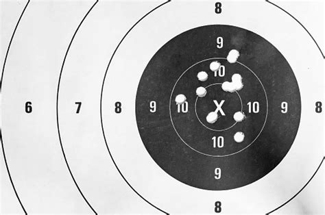 Shooting Target And Bullseye With Bullet Holes Stock Photo Download