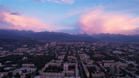 Pinkblue Large Clouds Over The City And Mountains Stock Footage