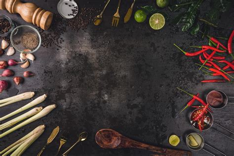 Spices for use as cooking ingredients on a wooden background with Fresh ...