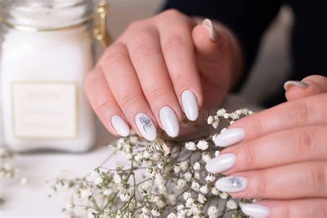 Female Hands With Romantic Manicure Nails Nude Gel Polish Flower Design Stock Photo Image Of