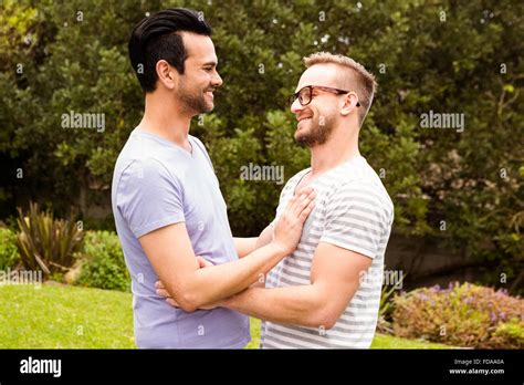 Smiling Gay Couple Hugging Stock Photo Alamy