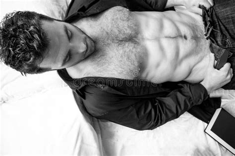 Shirtless Hunky Man With Beard And Six Pack Abs Lies Semi Naked In Bed Stock Image Image Of