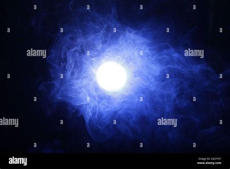 Smoke In Blue Light On Black Background Stock Photo Alamy