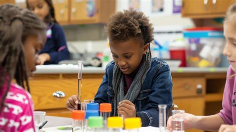 Premium Photo Young Girl In A Classroom Setting Conducts A Science Experiment With Test Tubes