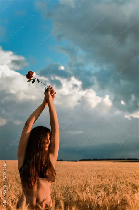 Girl With A Naked Back In The Field Blue Sky And Yellow Field Beautiful