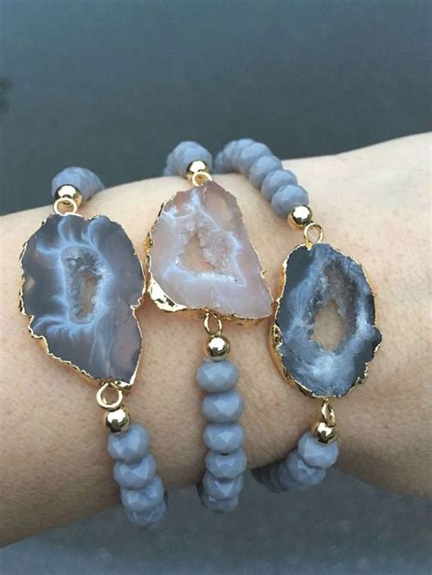 Three Bracelets With Blue Agate Beads And Gold Accents On A Woman S Arm