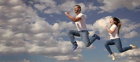 Father and Daughter Jump on Sky, Banner with Copy Space. Father and