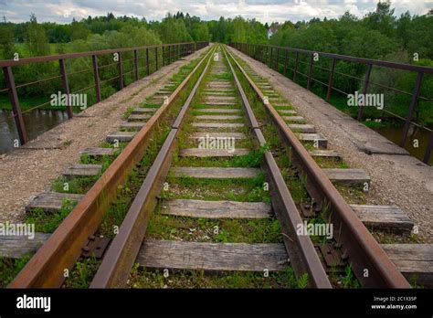 An Old Abandoned Railway Overgrown With Green Grass Stock Photo Alamy