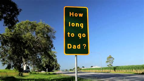 A Funny Road Sign On The Highway With Passing Traffic In Queensland, Australia Stock Footage ...