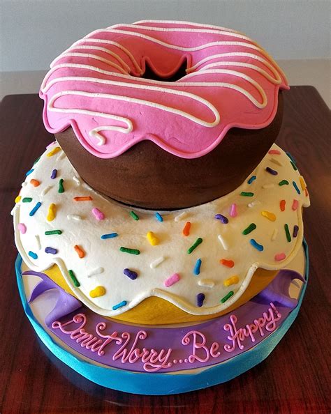 Donut Tiered Cake Adrienne And Co Bakery Donut Birthday Cake Donut Party Birthday Party Cake