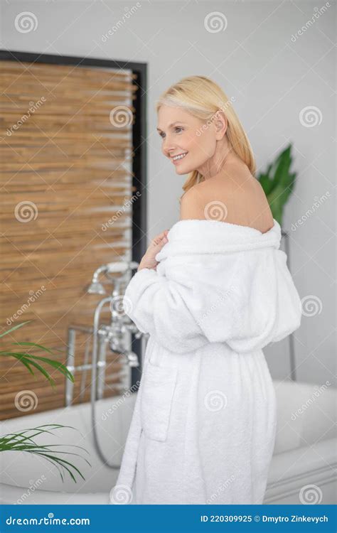 Pretty Woman In A White Robe With Naked Shoulders Stock Image Image