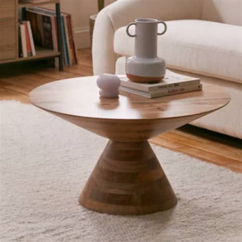 A Coffee Table Sitting On Top Of A White Rug