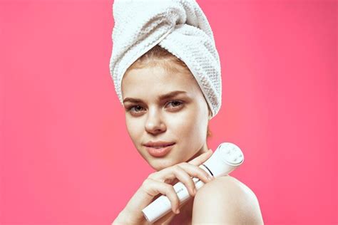 Premium Photo Woman With Towel On Head Naked Shoulders Skin Care Cosmetology Pink Background