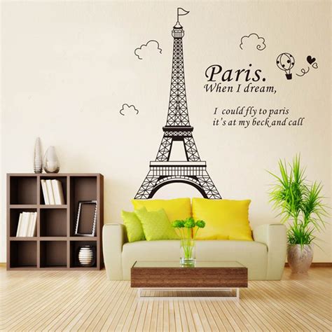 The Eiffel Tower Wall Decal Is Shown In This Living Room