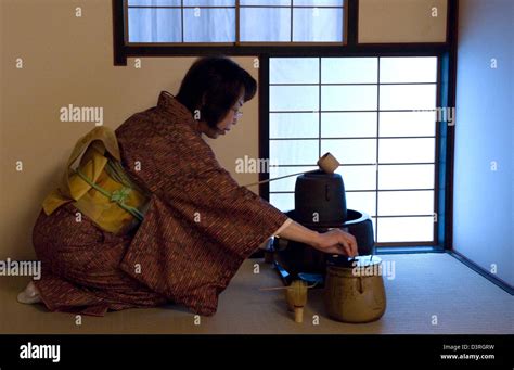 Woman In Tatami Mat Tea Room Prepares Tea Ceremony Utensils Kama