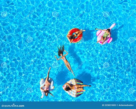 Aerial Of Hot Pretty Girls In Bikini Swimming In Pool On Floaties Top View From Above