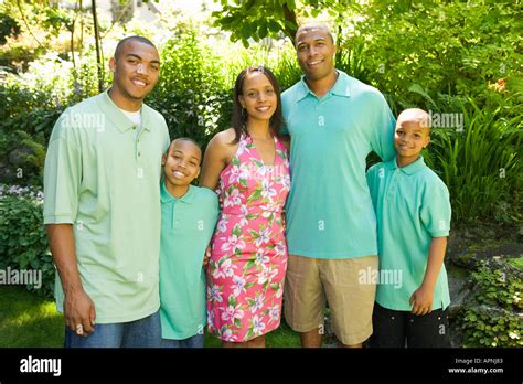 Family posing outdoors Stock Photo - Alamy