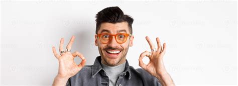 Close up portrait of satisfied male customer praising new glasses