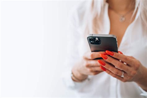 Woman Holding A Smartphone Free Stock Photo Picjumbo