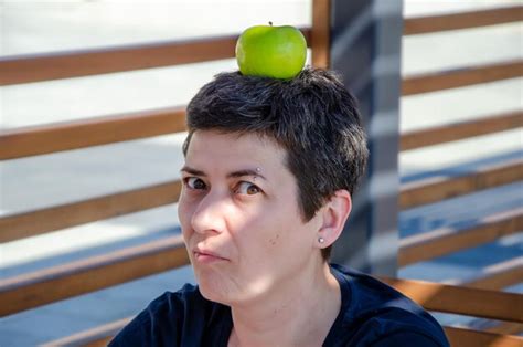 Premium Photo Woman With An Apple On Her Head Funny Woman Fooling