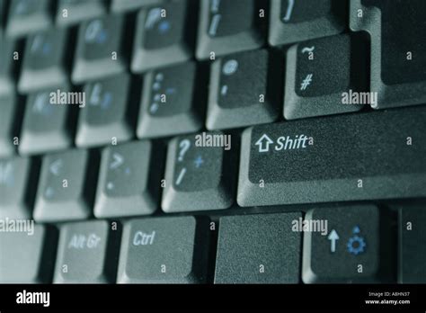 Laptop computer keyboard shift key Stock Photo - Alamy