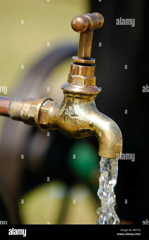 Tap Flowing Running Fresh Water Coming Out Of A Tap An Outside Garden