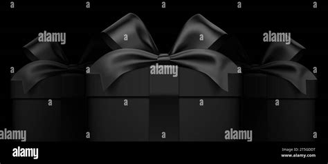 Premium Style Three Black Gift Boxes Wrapped With Satin Ribbons On A