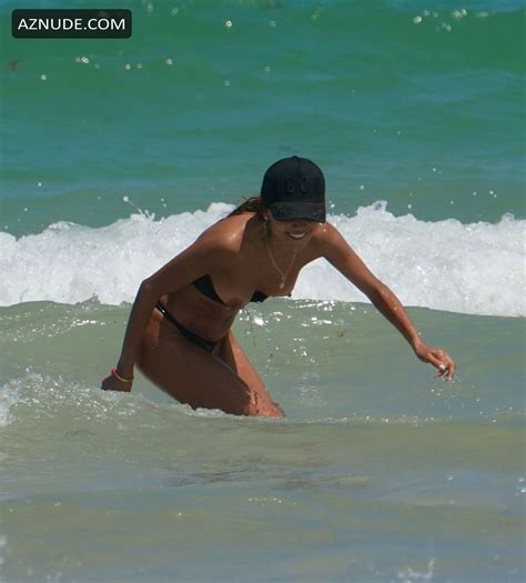 Patricia Gloria Suffers A Wardrobe Malfunction As A Wave Knocks Off Her Bikini At The Beach In