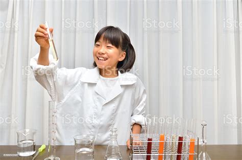 Japanese Girl Experiments In Science Stock Photo Download Image Now