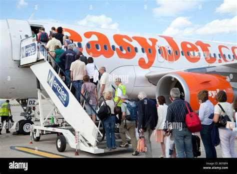 Passengers Boarding An Easyjet Plane At Stansted Airport UK Stock