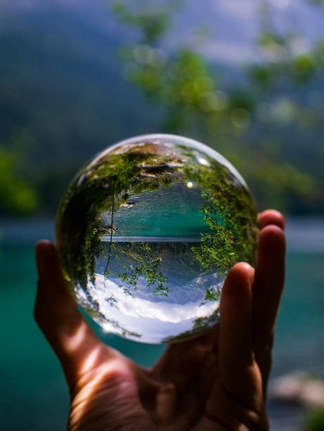 Premium Photo Cropped Hand Of Person Holding Crystal Ball