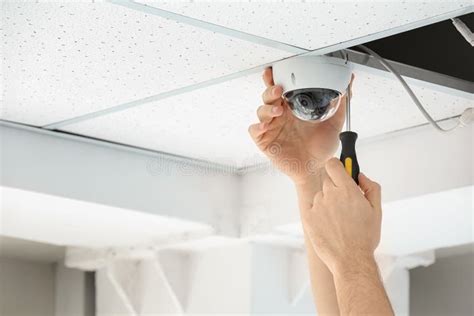 Technician Installing CCTV Camera On Ceiling Indoor Stock Photo Image