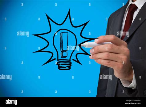 Composite Image Of Businessman Drawing Light Bulb Stock Photo Alamy