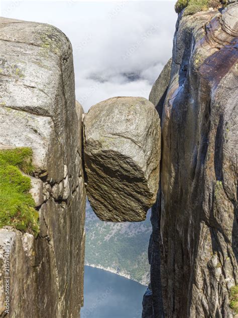 Kjeragbolten boulder located on the Kjerag mountain Stock Photo | Adobe ...